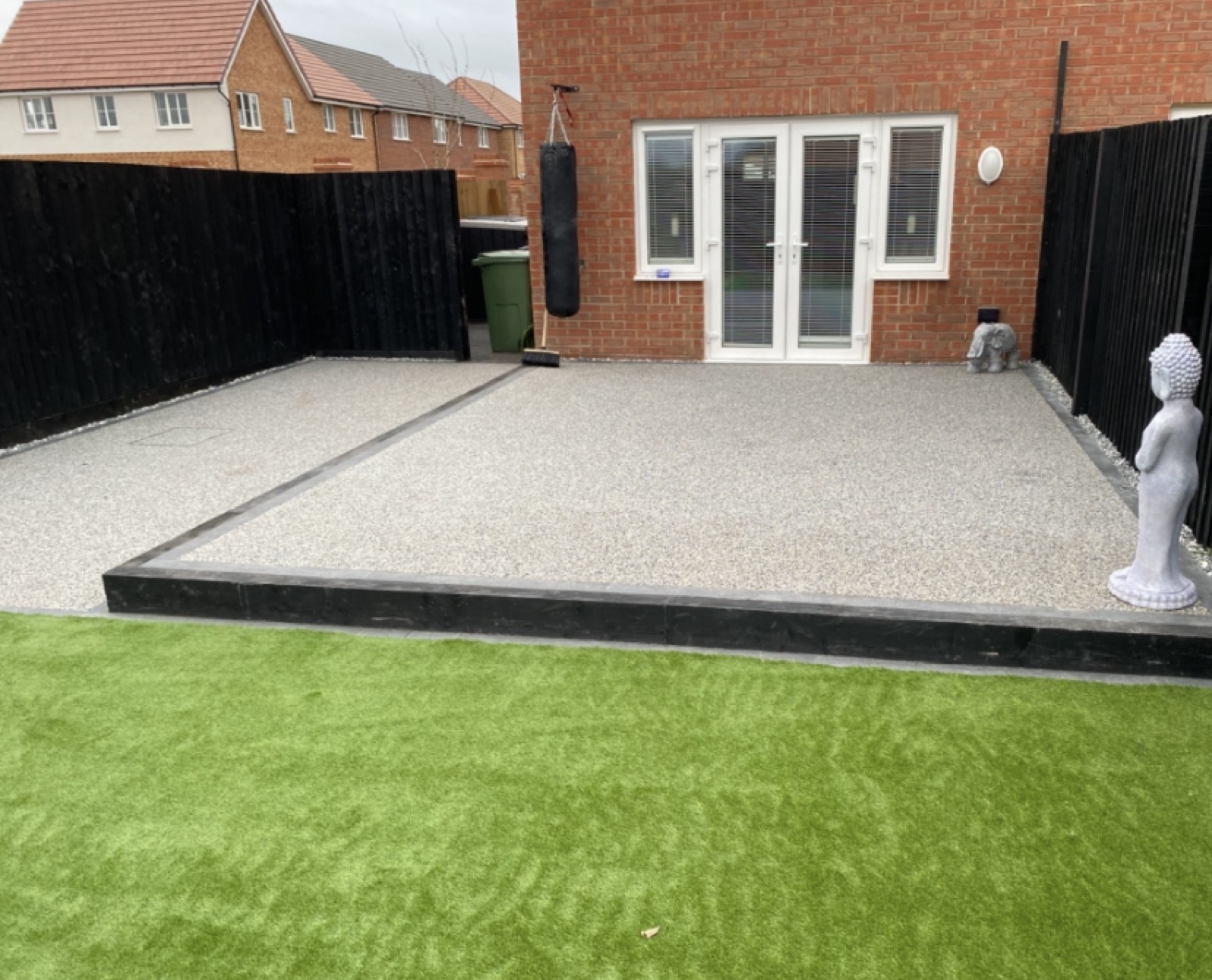 Finished resin garden with artificial grass border