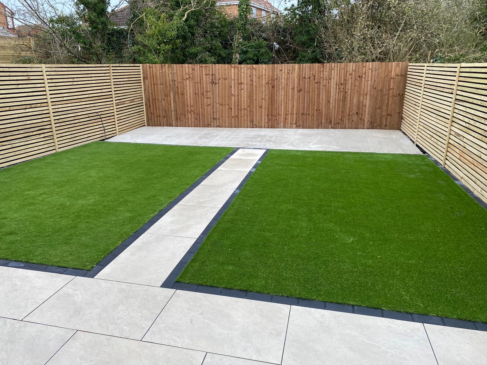 Porcelain patio with stepping stones and artificial grass