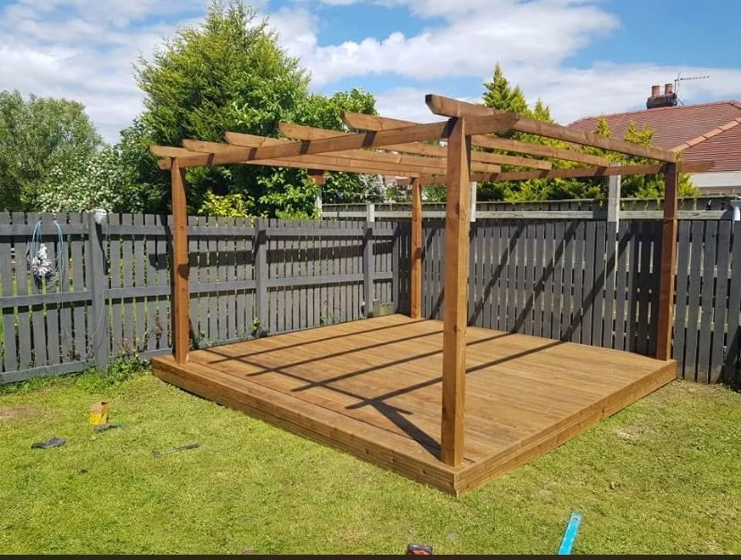 Timber pergola on a raised timber deck base in a Preston back garden by Hedgeway Paving